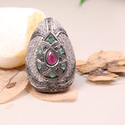 Vintage ruby and emerald cocktail ring in antique style silver setting.