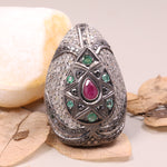 Vintage ruby and emerald cocktail ring in antique style silver setting.