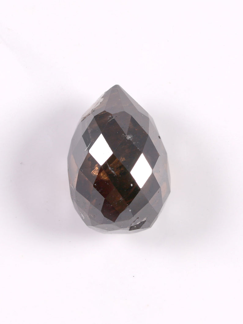 Teardrop-shaped diamond on a white background