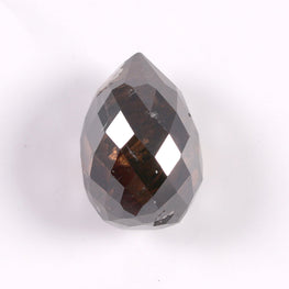 Teardrop-shaped diamond on a white background