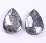 Two teardrop-shaped diamond on a white background