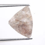 Natural pink peach diamond loose stone with deep color and bold appearance. Earth mined fancy diamond perfect for modern engagement rings.