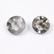 Pair of round rose cut lab grown salt and pepper diamonds with smoky gray tone and natural black inclusions, flat back faceting, matching loose stones for custom engagement rings or jewelry design.