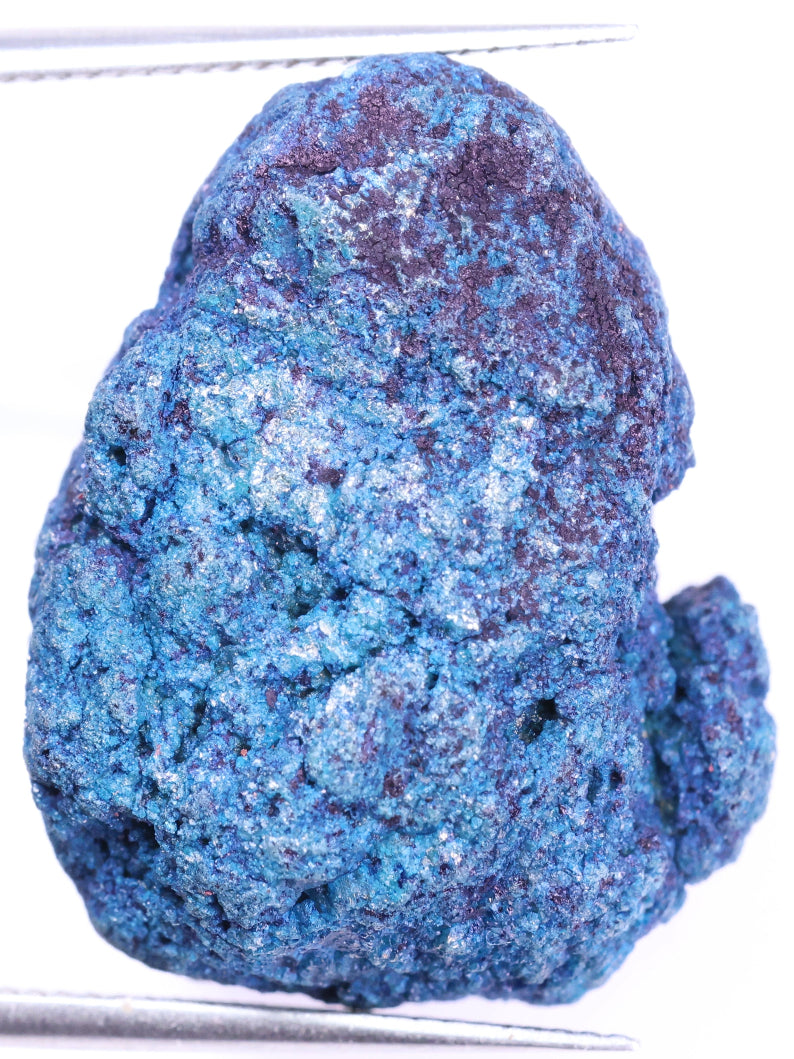 Blue mineral sample on a white background