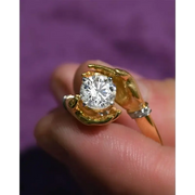 Artistic 1.5 Ct Round Lab Grown Diamond Ring in Hand-Holding Yellow and White Gold Ring
