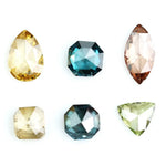 Fancy color diamond lot featuring pear, octagon, marquise and trillion mixed shape loose diamonds ideal for custom fine jewelry design, rings, pendants and luxury gemstone collections.