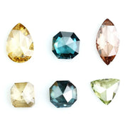 Fancy color diamond lot featuring pear, octagon, marquise and trillion mixed shape loose diamonds ideal for custom fine jewelry design, rings, pendants and luxury gemstone collections.