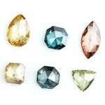 Fancy color diamond lot featuring pear, octagon, marquise and trillion mixed shape loose diamonds ideal for custom fine jewelry design, rings, pendants and luxury gemstone collections.