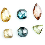 Fancy color diamond lot featuring pear, octagon, marquise and trillion mixed shape loose diamonds ideal for custom fine jewelry design, rings, pendants and luxury gemstone collections.