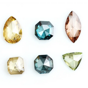 Fancy color diamond lot featuring pear, octagon, marquise and trillion mixed shape loose diamonds ideal for custom fine jewelry design, rings, pendants and luxury gemstone collections.