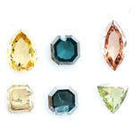 Fancy color diamond lot featuring pear, octagon, marquise and trillion mixed shape loose diamonds ideal for custom fine jewelry design, rings, pendants and luxury gemstone collections.
