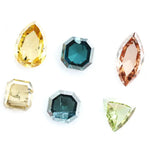 Fancy color diamond lot featuring pear, octagon, marquise and trillion mixed shape loose diamonds ideal for custom fine jewelry design, rings, pendants and luxury gemstone collections.