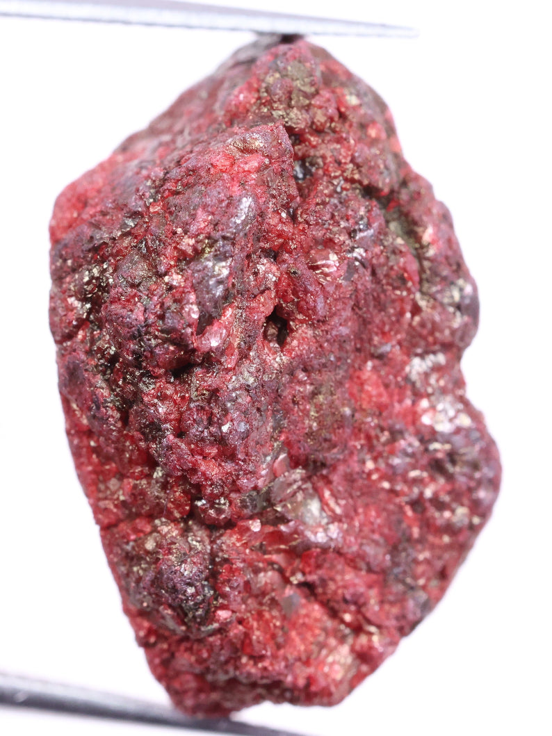Red mineral sample on a white background