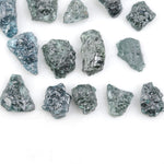 Raw rough diamonds and blue uncut raw diamond in natural unpolished rough 