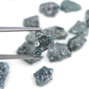 Raw rough diamonds and blue uncut raw diamond in natural unpolished rough 
