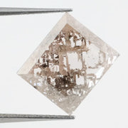 Emerald cut lab grown diamond featuring dramatic salt and pepper style inclusions with natural branching patterns, clear faceting and a unique galaxy-like internal structure.