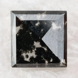 Square cut lab grown diamond with dramatic black and white salt and pepper galaxy inclusions in a geometric cut, showcasing a unique natural-looking pattern ideal for custom engagement rings or statement jewelry.