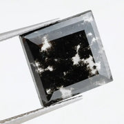 Square cut lab grown diamond with dramatic black and white salt and pepper galaxy inclusions in a geometric cut, showcasing a unique natural-looking pattern ideal for custom engagement rings or statement jewelry.