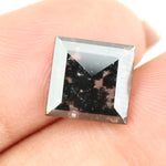 Square cut lab grown diamond with dramatic black and white salt and pepper galaxy inclusions in a geometric cut, showcasing a unique natural-looking pattern ideal for custom engagement rings or statement jewelry.