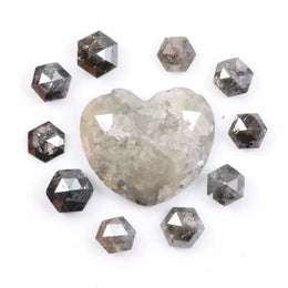 Large natural salt and pepper diamond heart surrounded by matching hexagon rose cut natural diamonds with visible galaxy-style inclusions on white background
