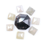 Natural salt and pepper diamond centerpiece with surrounding white and champagne pyramid-cut natural diamonds arranged in a circular layout on a white background.