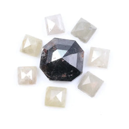 Natural salt and pepper diamond centerpiece with surrounding white and champagne pyramid-cut natural diamonds arranged in a circular layout on a white background.