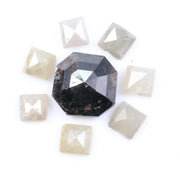 Natural salt and pepper diamond centerpiece with surrounding white and champagne pyramid-cut natural diamonds arranged in a circular layout on a white background.