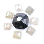 Natural salt and pepper diamond centerpiece with surrounding white and champagne pyramid-cut natural diamonds arranged in a circular layout on a white background.