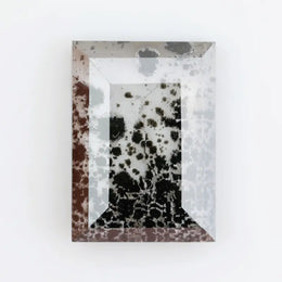 Contemporary lab grown diamond inspired crystal wall art with organic black mineral growth patterns inside a geometric mirrored frame, creating a modern reflective luxury statement piece.