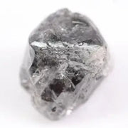 Raw uncut gray diamond showing natural crystal structure