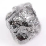 Raw uncut gray diamond showing natural crystal structure