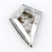Kite-cut lab grown diamond with natural-style internal inclusions, geometric faceting, and transparent crystal body, photographed on a white background for ethical fine jewelry and custom engagement ring design.