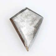 Kite-cut lab grown diamond with natural-style internal inclusions, geometric faceting, and transparent crystal body, photographed on a white background for ethical fine jewelry and custom engagement ring design.