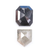 Natural black octagon-cut diamond and shield-cut salt-and-pepper diamond displayed on white background, showing unique inclusions and rustic faceting details.