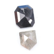 Natural black octagon-cut diamond and shield-cut salt-and-pepper diamond displayed on white background, showing unique inclusions and rustic faceting details.