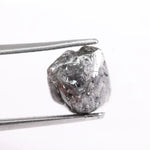 Raw uncut gray diamond showing natural crystal structure
