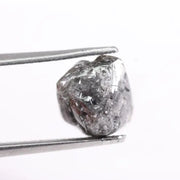 Raw uncut gray diamond showing natural crystal structure