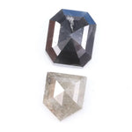Natural black octagon-cut diamond and shield-cut salt-and-pepper diamond displayed on white background, showing unique inclusions and rustic faceting details.