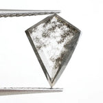 Kite-cut lab grown diamond with natural-style internal inclusions, geometric faceting, and transparent crystal body, photographed on a white background for ethical fine jewelry and custom engagement ring design.