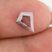 Kite-cut lab grown diamond with natural-style internal inclusions, geometric faceting, and transparent crystal body, photographed on a white background for ethical fine jewelry and custom engagement ring design.