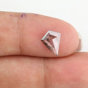 Kite-cut lab grown diamond with natural-style internal inclusions, geometric faceting, and transparent crystal body, photographed on a white background for ethical fine jewelry and custom engagement ring design.