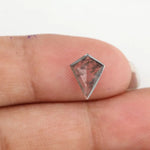 Kite-cut lab grown diamond with natural-style internal inclusions, geometric faceting, and transparent crystal body, photographed on a white background for ethical fine jewelry and custom engagement ring design.