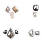 Assorted natural salt and pepper diamonds in geometric fancy cuts including kite, shield, emerald, pear, half moon, and octagon shapes in earthy tones of grey, champagne, cognac, and blush with visible natural inclusions.