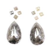 Large pear shaped salt and pepper natural diamond with dramatic black and grey inclusions paired with kite shaped accent diamonds, rustic galaxy diamond set ideal for alternative engagement ring or custom fine jewelry design.