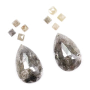 Large pear shaped salt and pepper natural diamond with dramatic black and grey inclusions paired with kite shaped accent diamonds, rustic galaxy diamond set ideal for alternative engagement ring or custom fine jewelry design.