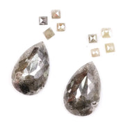 Large pear shaped salt and pepper natural diamond with dramatic black and grey inclusions paired with kite shaped accent diamonds, rustic galaxy diamond set ideal for alternative engagement ring or custom fine jewelry design.