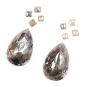 Large pear shaped salt and pepper natural diamond with dramatic black and grey inclusions paired with kite shaped accent diamonds, rustic galaxy diamond set ideal for alternative engagement ring or custom fine jewelry design.