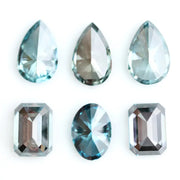 Fancy blue lab grown diamonds mix shapes including pear, oval and emerald cut loose CVD diamonds for engagement rings, custom jewelry making and fine jewelry designs with brilliant sparkle and modern sustainable luxury.