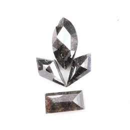 Set of natural salt and pepper diamonds with dark galaxy inclusions in mixed faceted shapes including marquise, kite and baguette cut stones for unique custom jewelry or engagement ring designs.