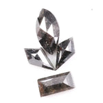 Set of natural salt and pepper diamonds with dark galaxy inclusions in mixed faceted shapes including marquise, kite and baguette cut stones for unique custom jewelry or engagement ring designs.